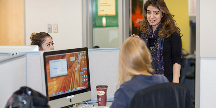 Centennial College students talking to each other